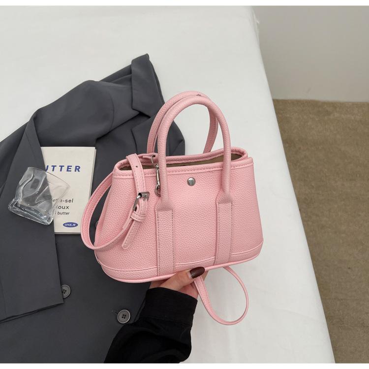 2025 New Niche Simple Leisure Commuter Portable Bucket Bag Versatile Solid Color Child and Mother Bag Messenger Bag Bag
