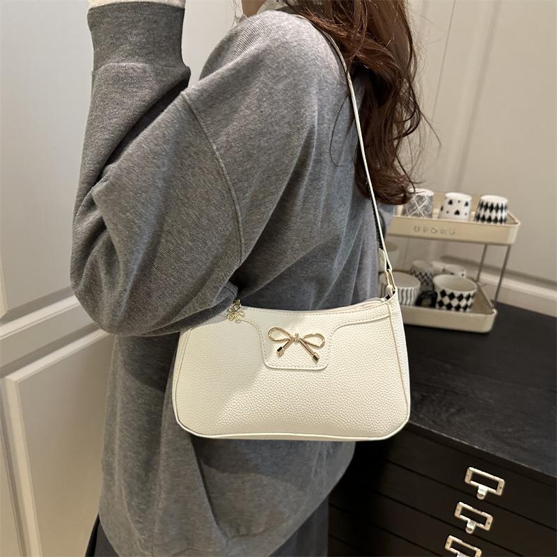 Solid color fashion bow new trendy texture commuting shoulder underarm baguette bag women