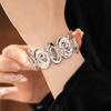 Spiral Lumina Oval Hollow Metal Statement Bracelet-Hand Ring with High-End Niche Appeal