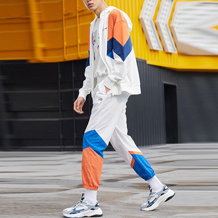 Li Ning Sports Fashion Series Logo Pattern Splicing Design Tapered Knit Pants Autumn Men Bottoms White AKXR421-3
