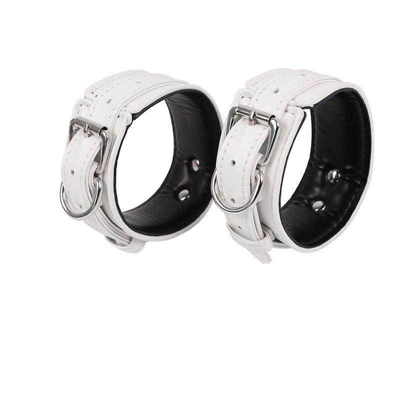 Bundle set includes waist belt, wrist and thigh covers, cross buckle, adult game restraint device, handcuffs, leg covers, and sex toys