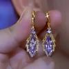 Exquisite Rhinestone Leaves Pendant Gold Color Earrings for Women New Fashion Trend Elegant Ladies Party Birthday Gift