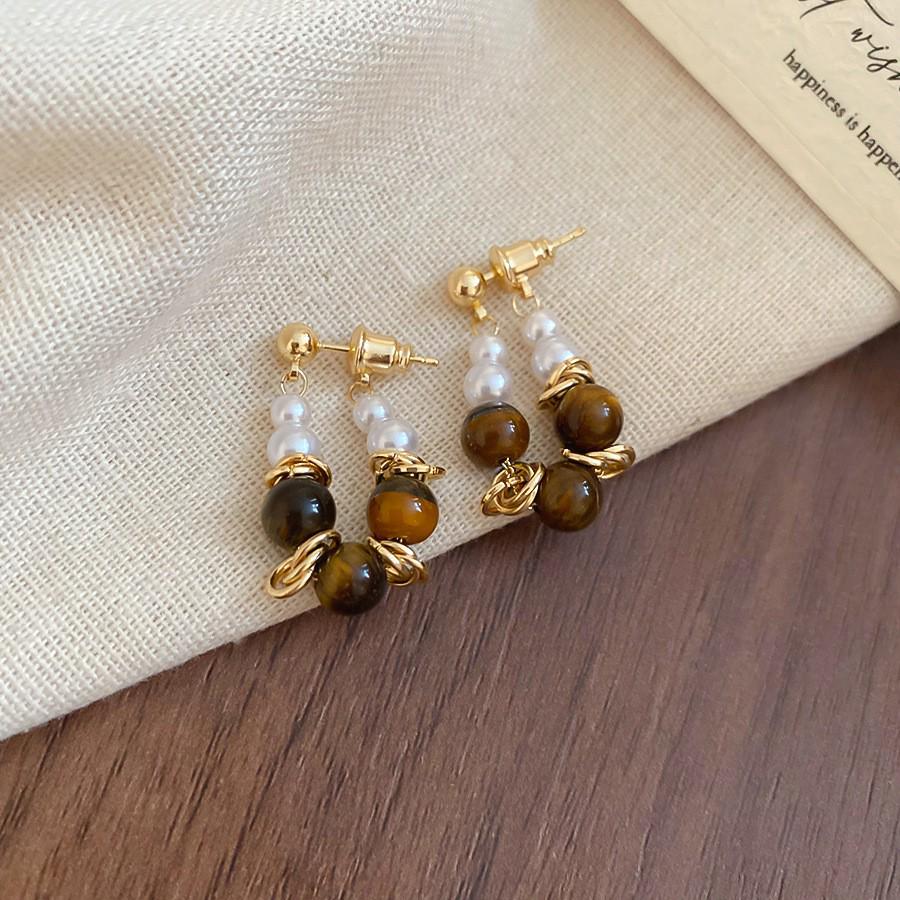 Silver Needle Tiger's Eye Style Earrings: Elegant, Fashionable Studs with Caramel Color Finish.