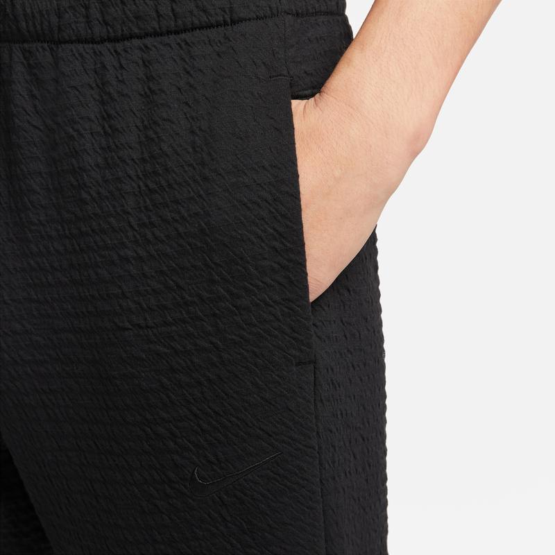 Nike Pánské pánské kalhoty s masivním texturovaným logem a stahovací šňůrkou černé DV9886-010