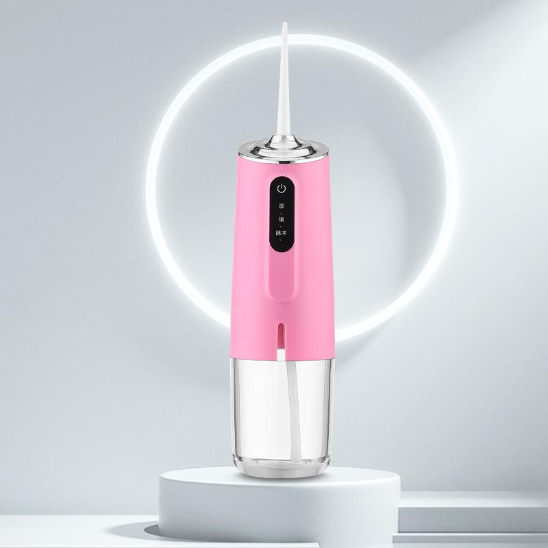 

Портативный электрический ирригатор и очиститель зубов для ухода за полостью рта розовый