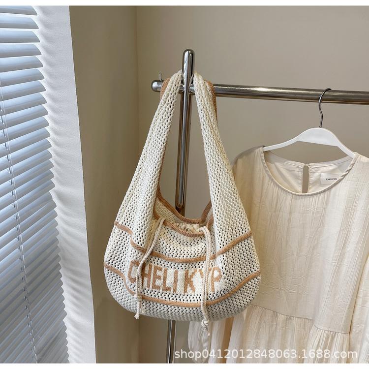 

Korean version of simple literary woven tote bag women s 2025 summer new retro hollow letter shoulder armpit bag хаки