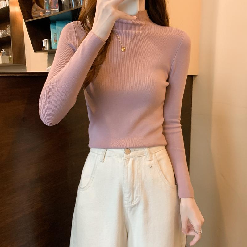 Nuevo invierno ajustado tejido de punto Color sólido cuello redondo señoras moda camisa por el trasero suéter mujer ropa
