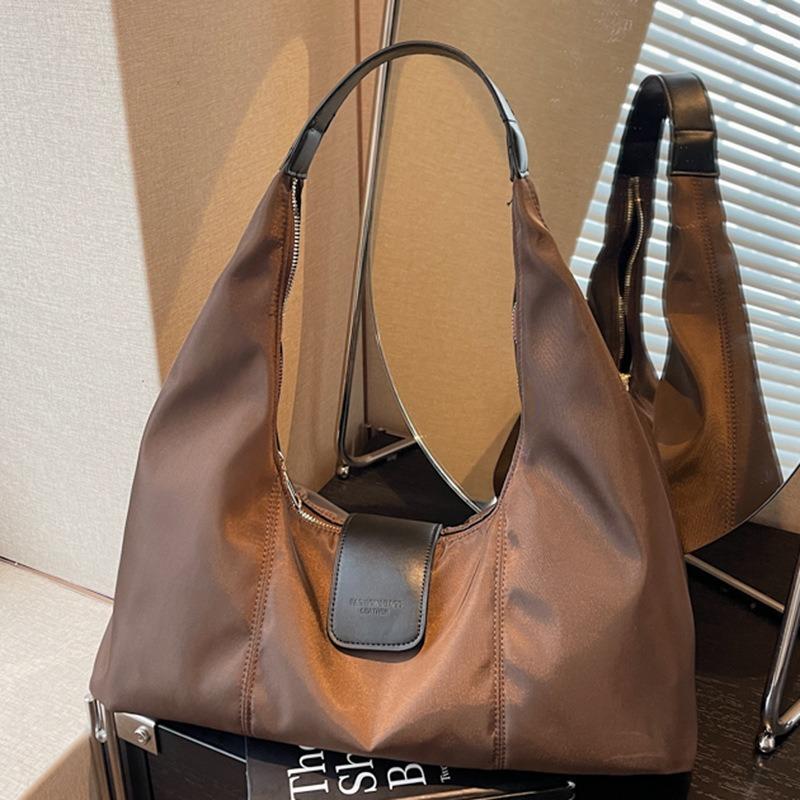 Hochwertige einseitige Achseltasche Damen Retro-Textur Große Kapazität Damen-Tasche Nischen-Tragetasche