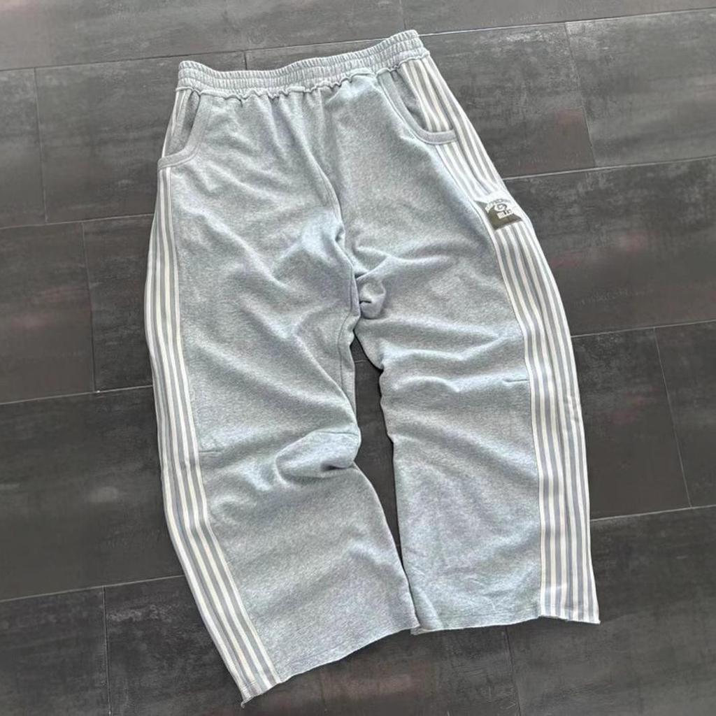 Unisex volné pruhované tepláky širokého střihu