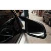 BMW 5 Series F10/F18 Horn Style Rearview Mirror Housing Backup Camera Cover, Glossy Black Carbon Fiber Pattern.