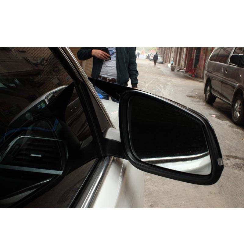 BMW 5 Series F10/F18 Horn Style Rearview Mirror Housing Backup Camera Cover, Glossy Black Carbon Fiber Pattern.