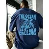 Men's Oversized Navy Blue Short Sleeve T-shirt with Crew Neck, Soft Cotton Feel, Featuring Bold Light Blue Turtle Graphic and 'the Ocean Is Calling'