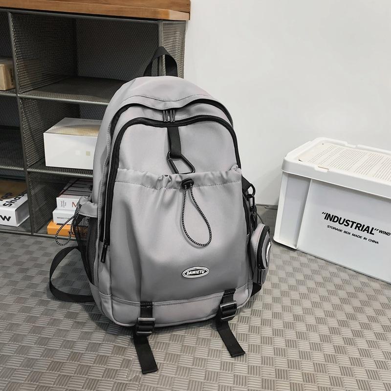 Backpack simple and fashionable college student junior high school student schoolbag female nylon large capacity leisure travel backpack male