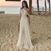 French white off-the-shoulder hollow pleated dress, high-end female summer pure desire wind vacation beach fairy long dress