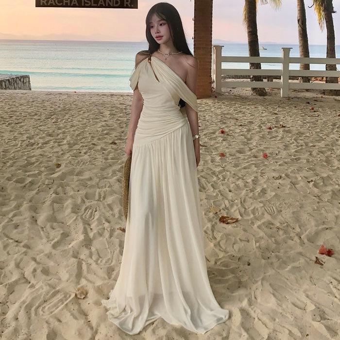 French white off-the-shoulder hollow pleated dress, high-end female summer pure desire wind vacation beach fairy long dress