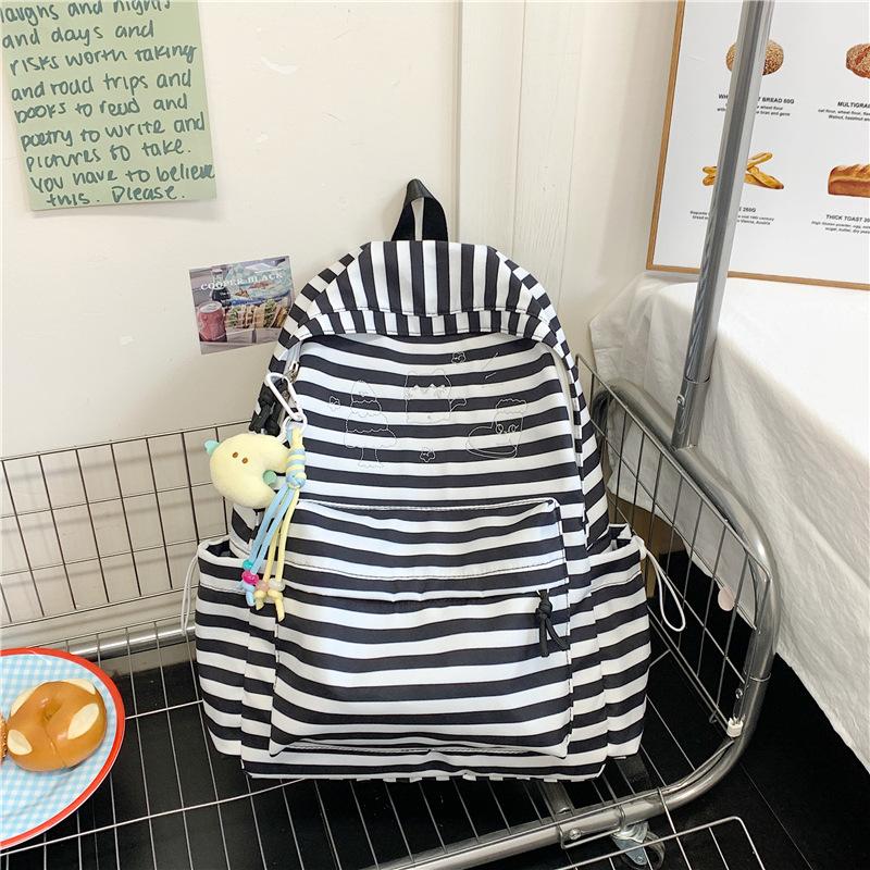 The New Schoolbag Is High-value, Fresh and Sweet, Striped Backpack, Lightweight and Large-capacity Backpack for Junior and High School Students.