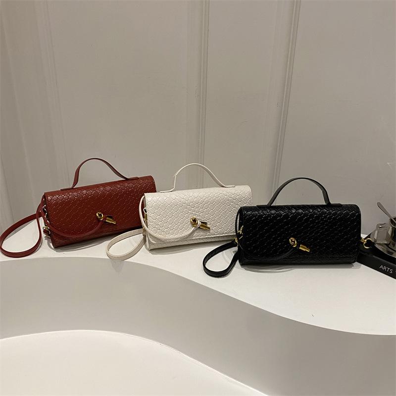 Mode exquisite Weberei 2025 einfarbig lässig Schloss große Kapazität ausländischer Stil horizontal Umhängetasche Baguette Damen Tasche