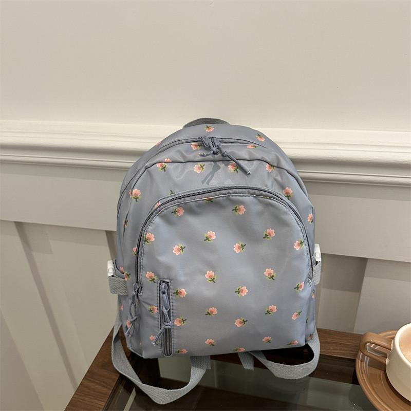 Urban Minimalist College Print Backpack With Durable Polyester And Stitching Detail For Casual Travel