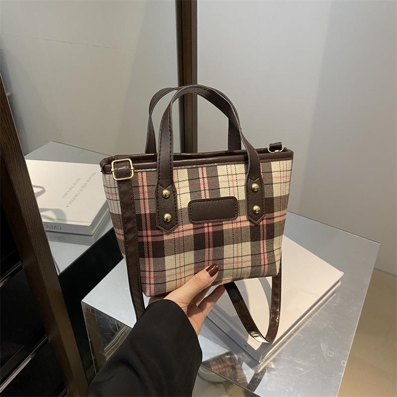 Light luxury plaid portable bucket bag women's classic niche design foreign-style texture shoulder messenger bag