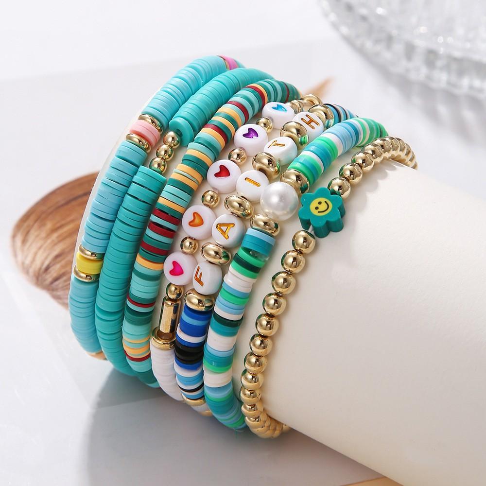 Korean version of fashion new multi-layer elastic thread soft pottery love smiley face bracelet set retro handmade pearl jewelry women