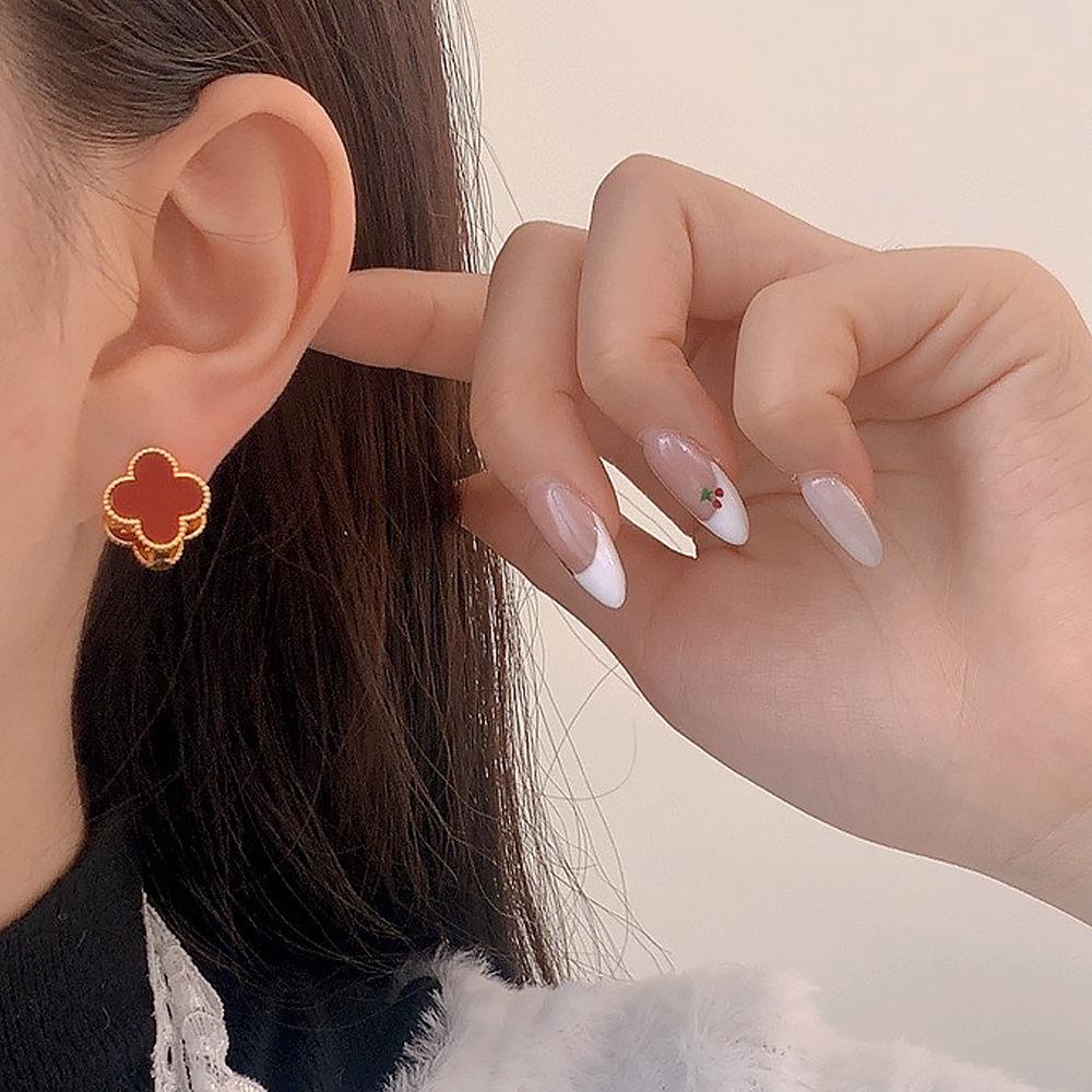 Trendige Glücksblume Vorwärts- und Rückwärts-Ohrringe Französische Mode High Fashion Vierblättrige Kleeblatt-Ohrringe