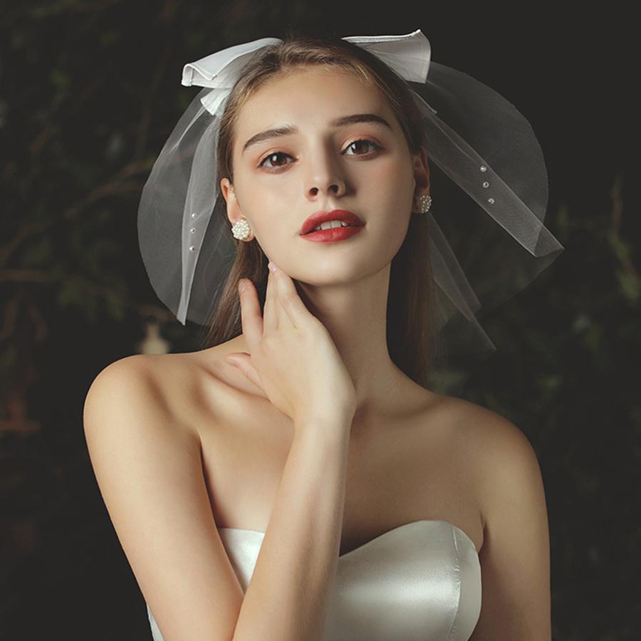 Elegante Hochzeit Braut Hochzeit Kopfschmuck Weißer Schleier Kopfschmuck Imitationsperle Schleife Kurzer Schleier Hinterkopfdeko Haaraccessoires