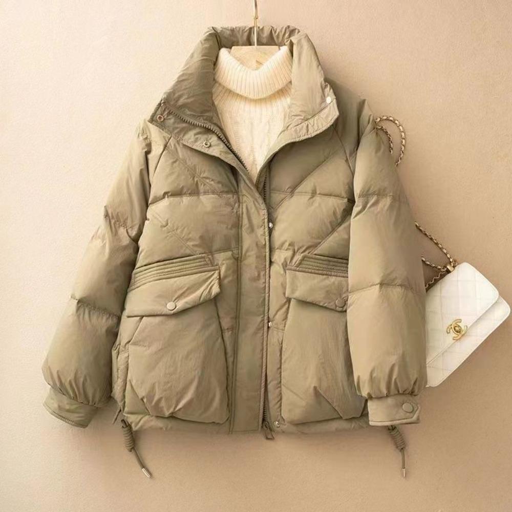 The new versatile down cotton-padded jacket with a loose stand-up collar and thickened coat in the Korean style is trendy