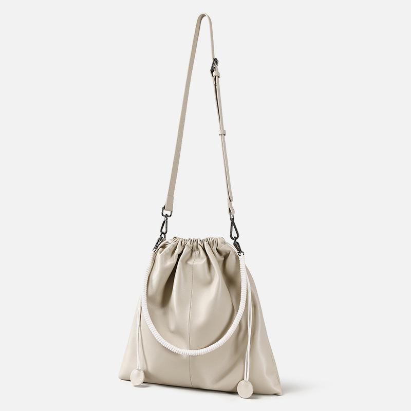 

New first-layer cowhide mother and child bag pleated bundle mouth lazy wind soft leather shoulder bag large capacity leather messenger bag women абрикосовий