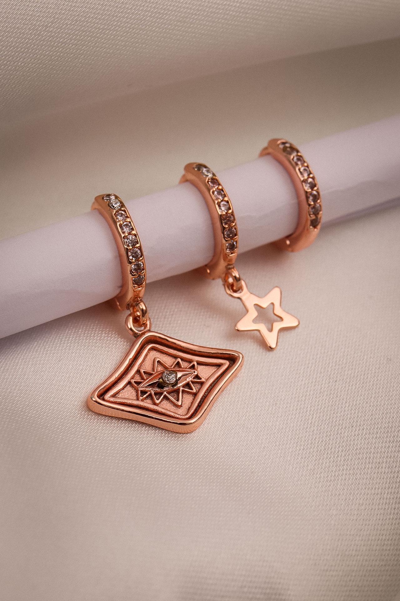 

Серьги из трех частей золотого цвета с глазами