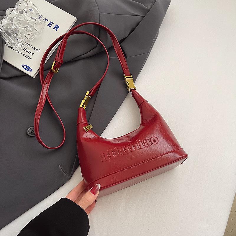 Trendy New Korean High-grade Texture Oil Wax Leather Hand-carried Dumpling Bag Temperament Versatile Commuter Women's Messenger Bag