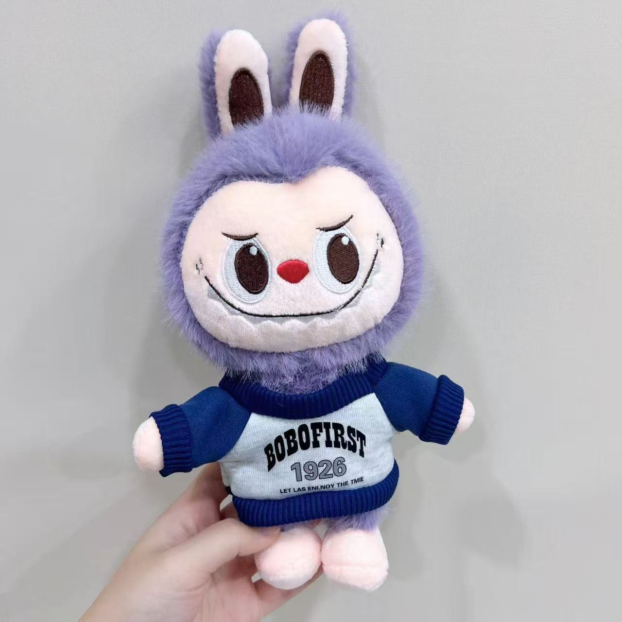 

Small cloth cloth plush toy doll popular sweater tooth doll activity gift grab machine doll 28cm (random sweater color) фиолетовый