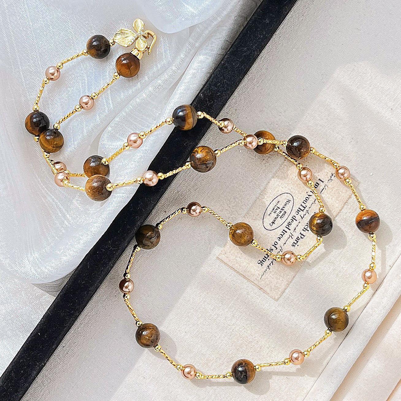 

Autumn And Winter Maillard Style Natural Tiger S Eye Stone Gold Coffee Color Shijia Pearl Sweater Chain Necklace Female